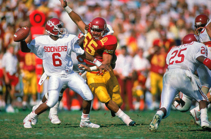 Seau gets after quarterback Charles Thompson in a USC upset of Oklahoma, in 1988.